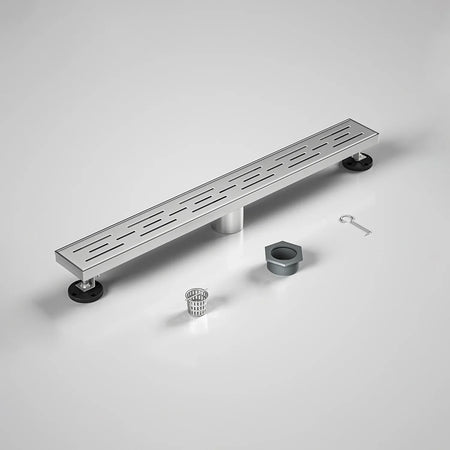 Stainless steel linear shower drain with installation parts on a white background