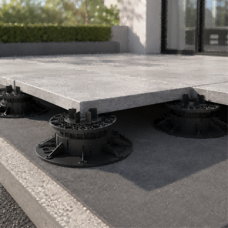 Adjustable pedestal system B-1 supporting 24x24 inch pavers on a rooftop deck installation